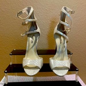 Faux snakeskin high heel shoe.